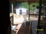 This is the patio deck, from the upper level of the house.  It needs clearing.  Note the large pile of dirt that's where our Pool should be.