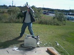 Phil gives it a try with the concrete brick.